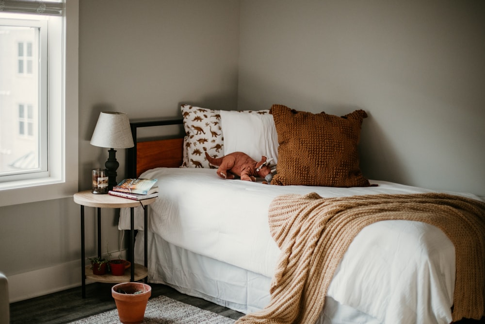 white and brown throw pillows on white and brown couch