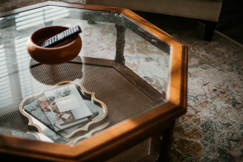 brown wooden frame glass top table