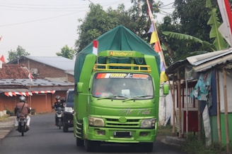 green van on road during daytime