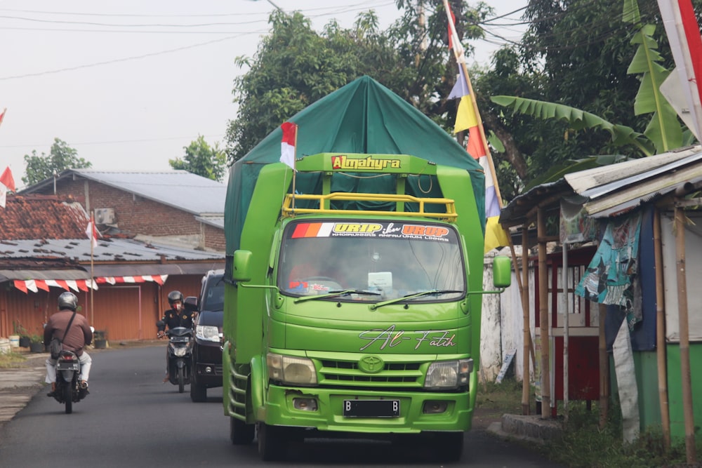green van on road during daytime