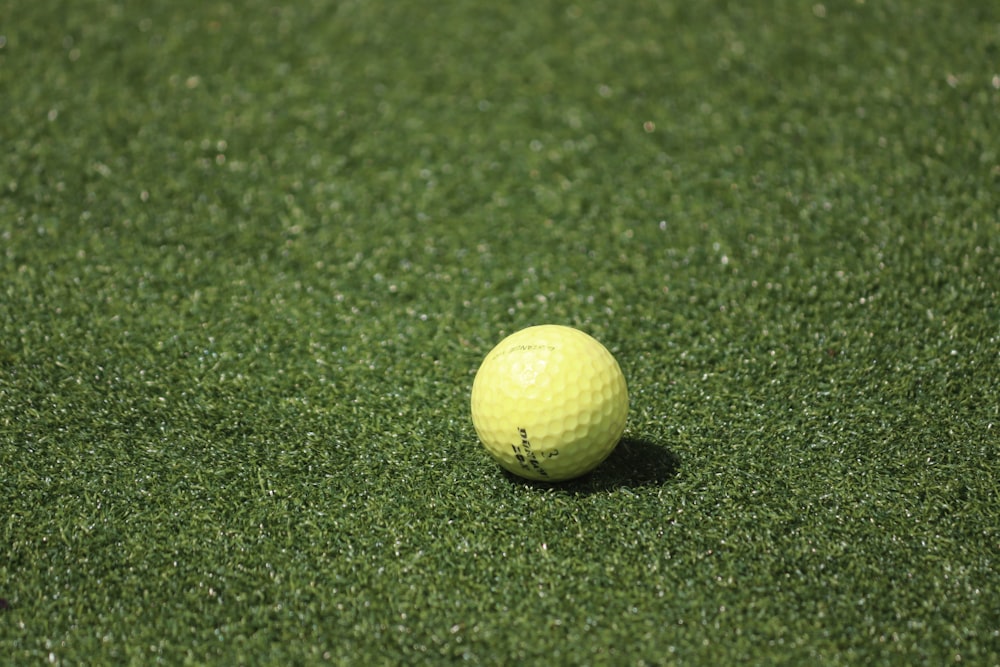 white golf ball on green grass field