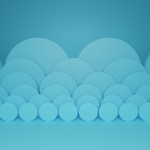 white round plastic ornament on teal surface
