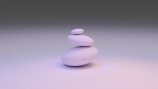 white round stone on white surface