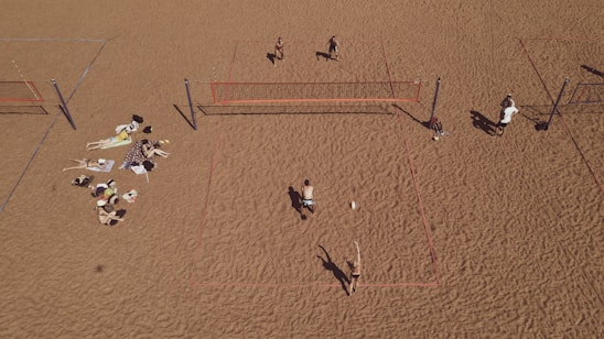 A lively beach volleyball game with friends enjoying barbecue and live pagode music in the background.