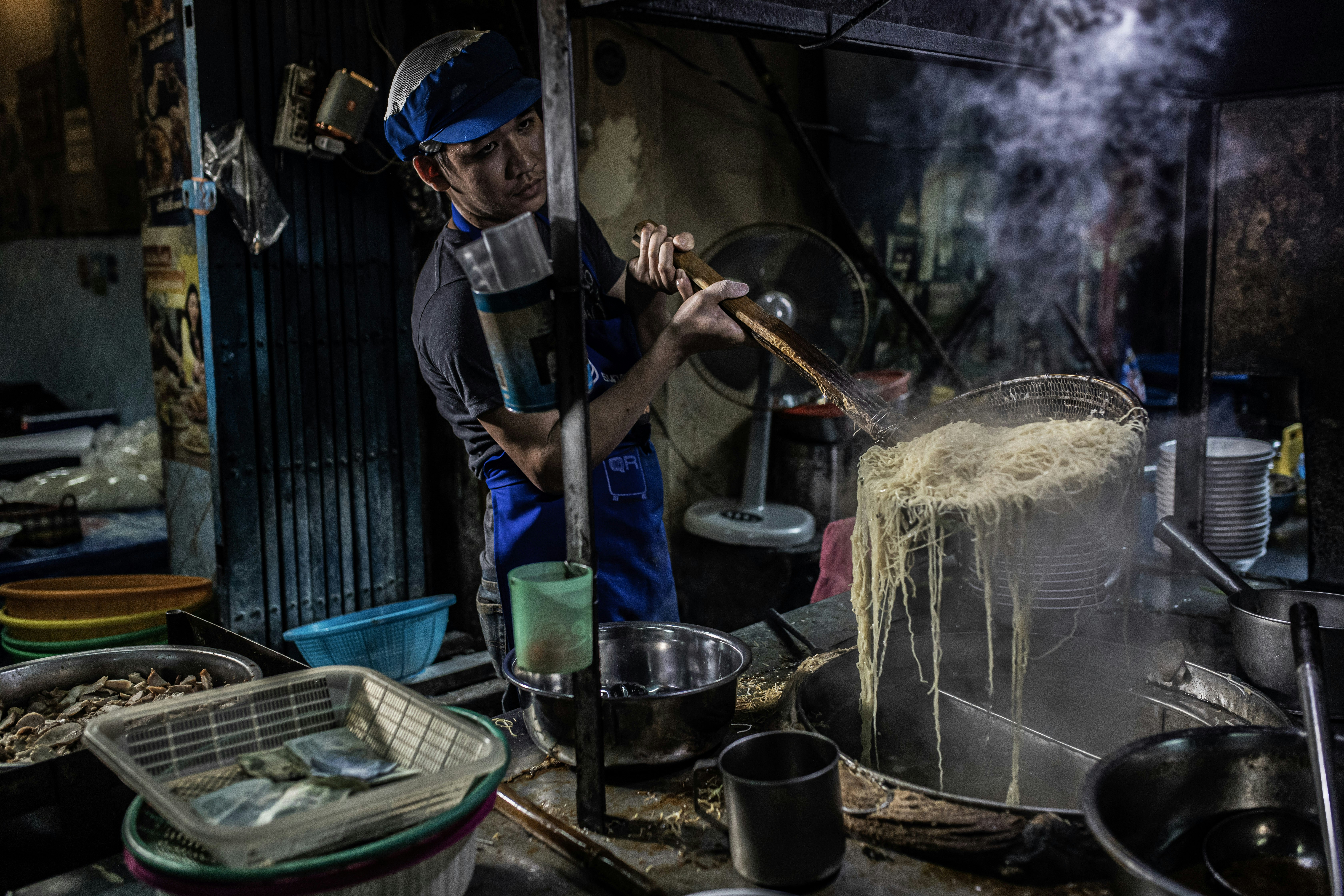 Cooking noodles on the streets of Bangkok's Chinatown.