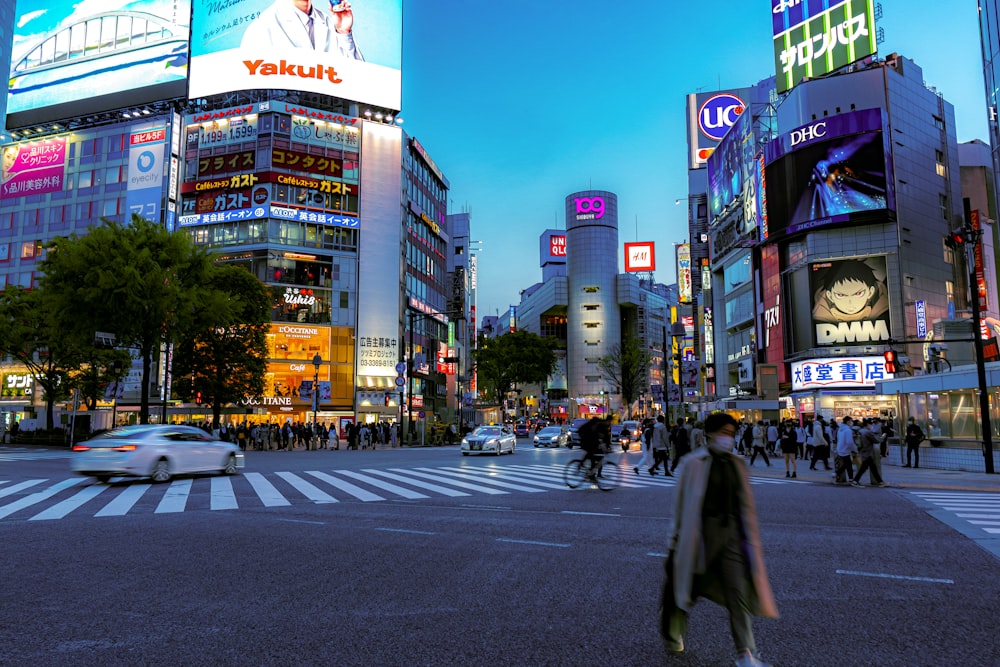 people walking on pedestrian lane during night time