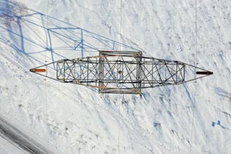 black metal tower on snow covered ground