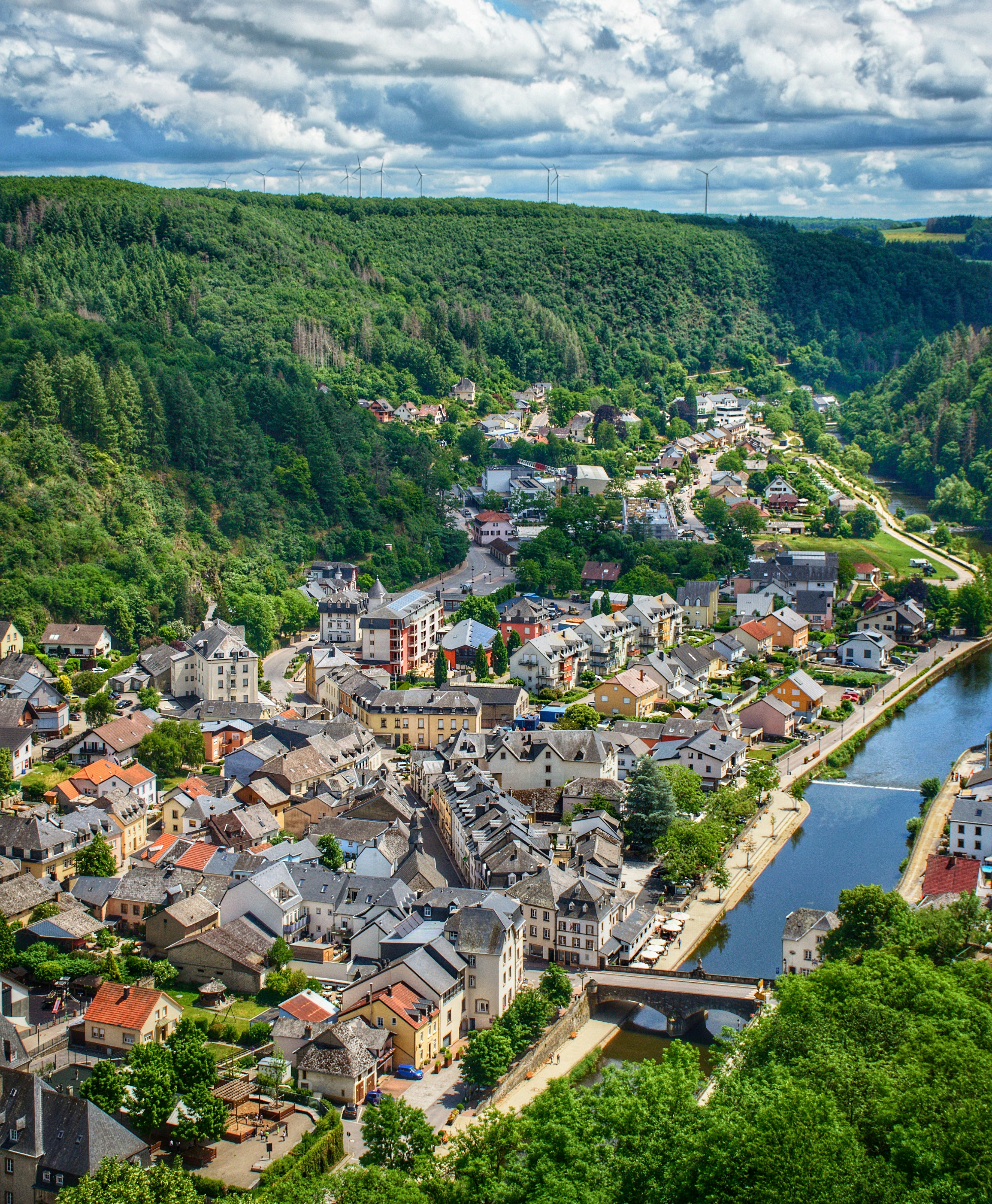aerial view of city buildings near green trees during daytime