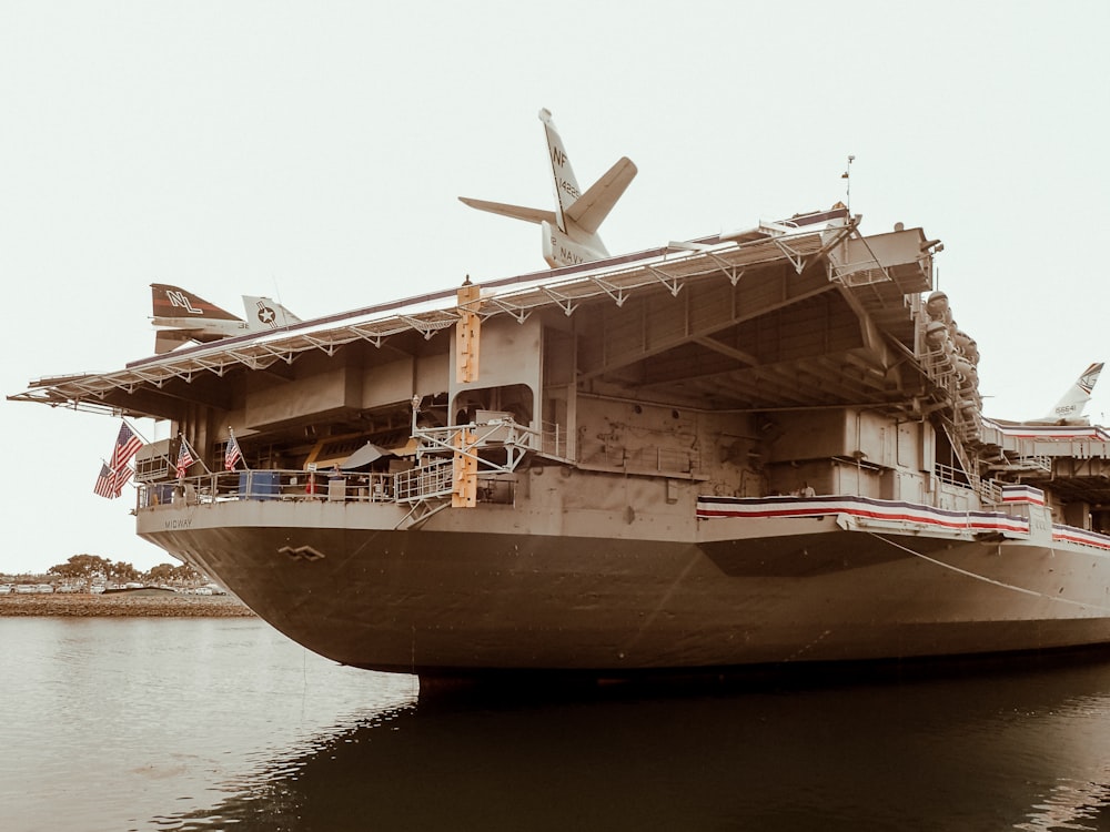 gray ship on body of water during daytime