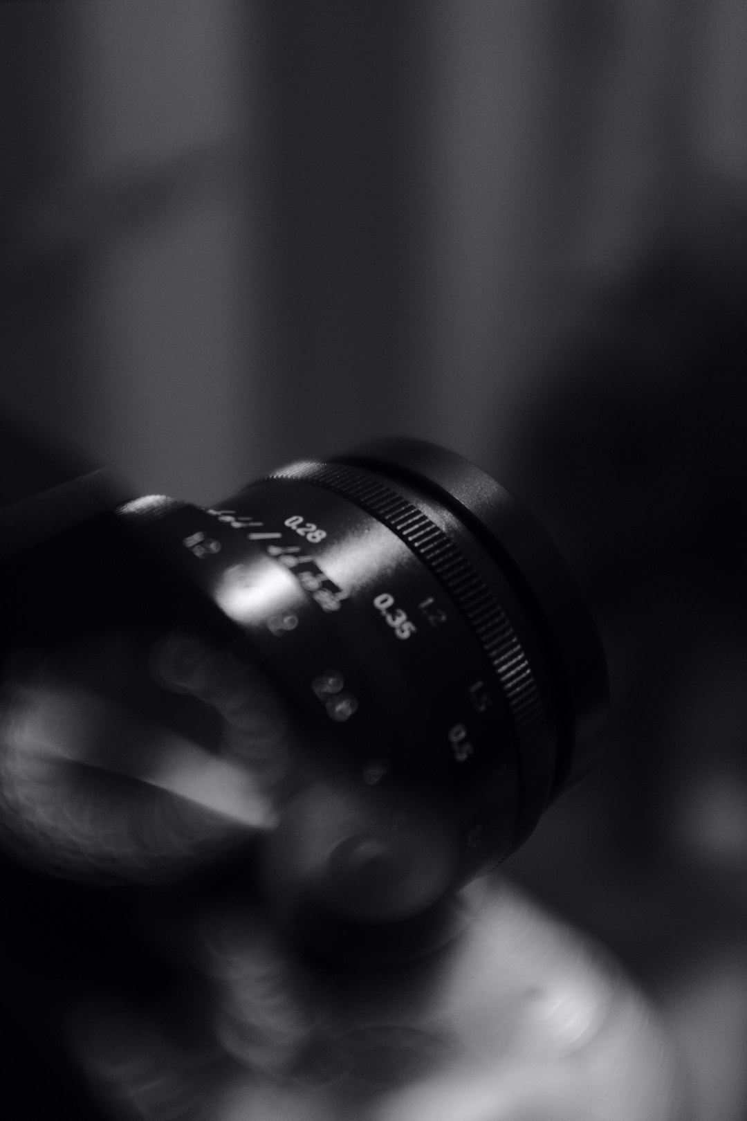 black camera lens in grayscale photography