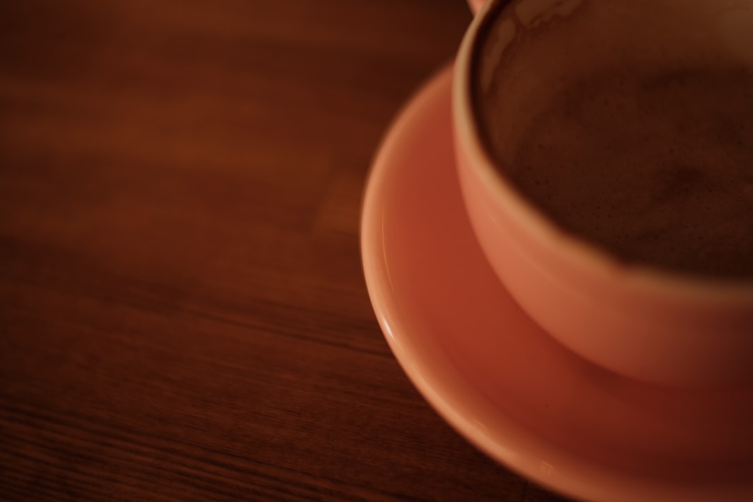 white ceramic cup on white ceramic saucer