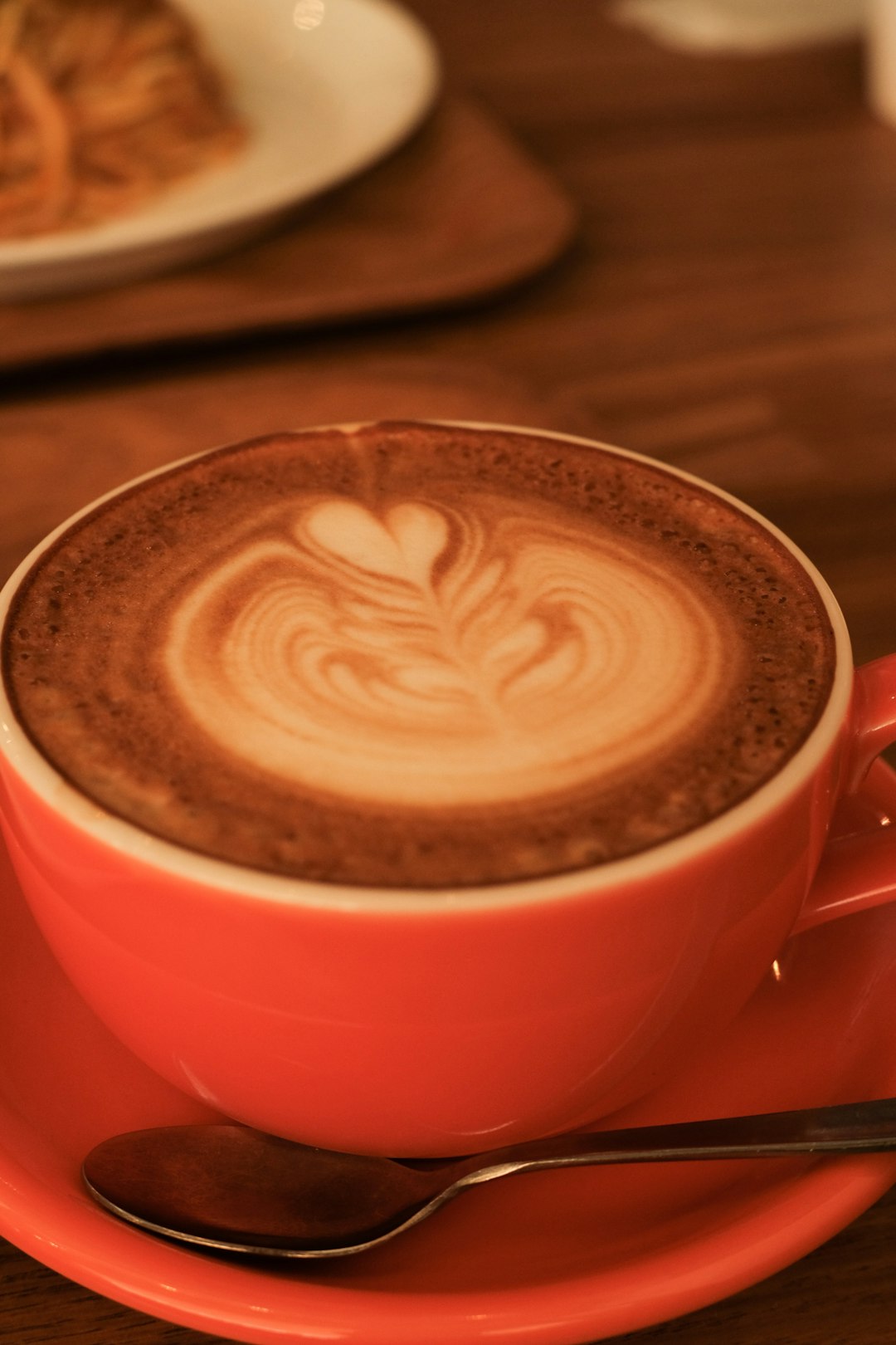 red ceramic mug with coffee