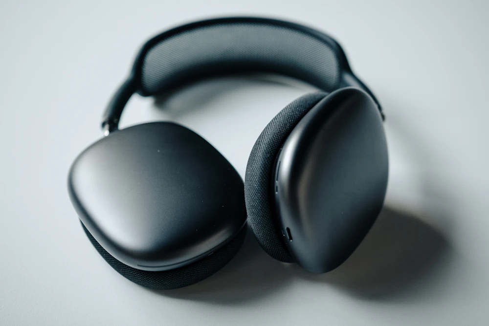 Premium black over-ear headphones on a desk