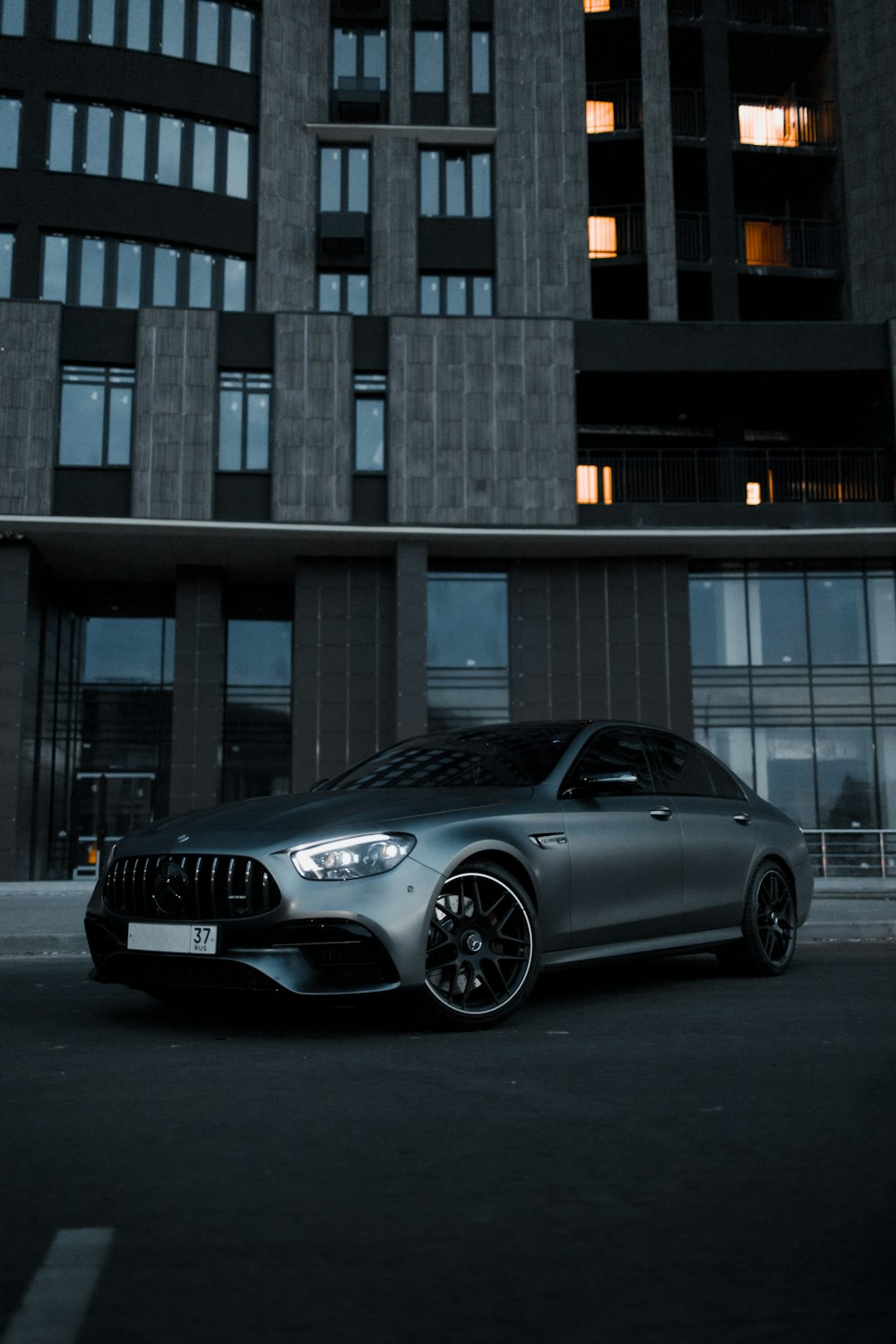 black bmw m 3 coupe parked in front of building