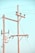 Wooden utility poles with cross-arms hold multiple power lines against a clear blue sky. Electrical insulators are attached to the poles, and there is a transformer box visible.