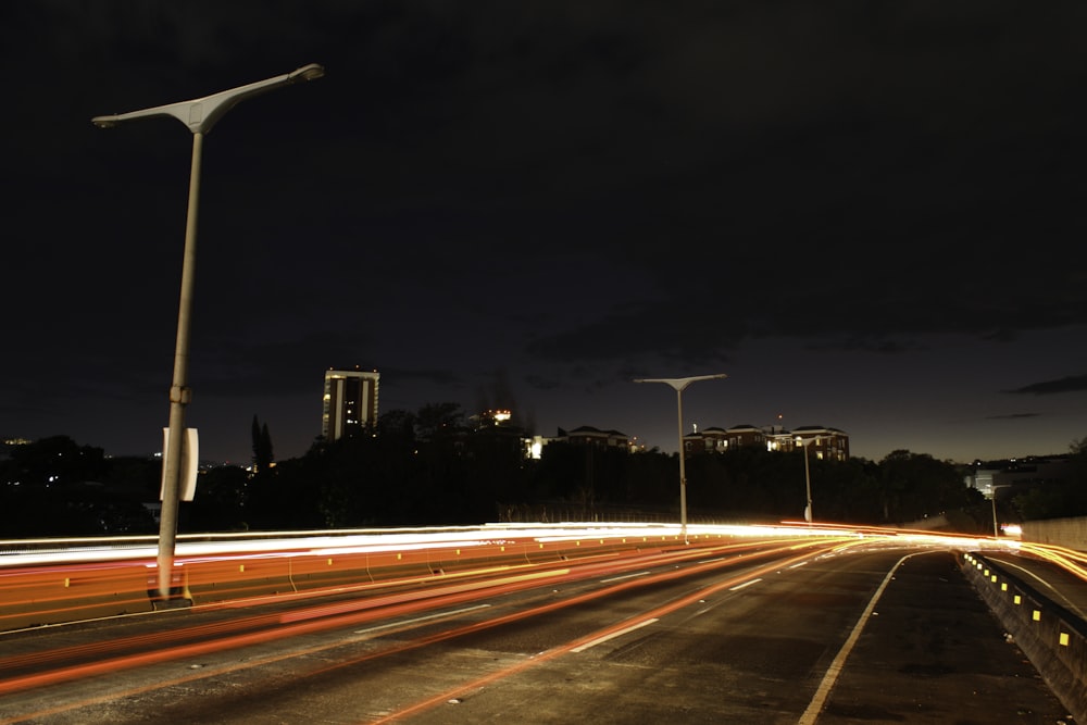 time lapse photography of cars on road during night time