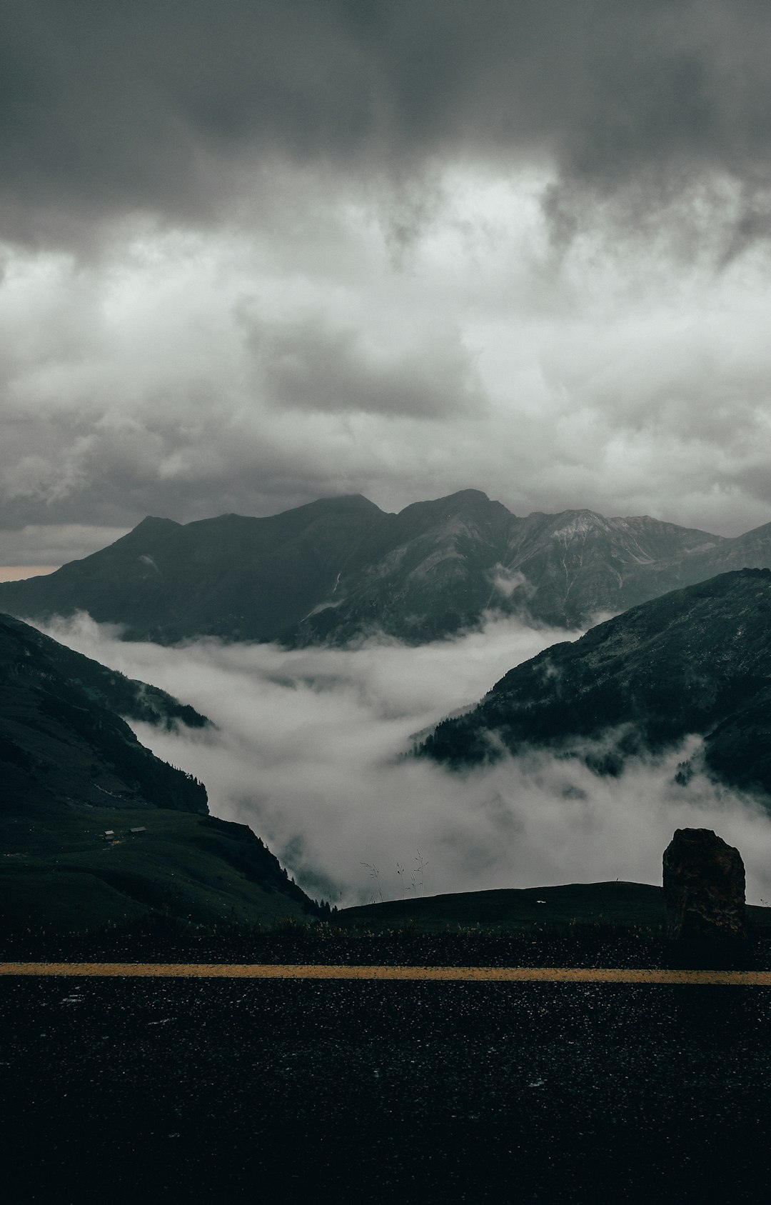 black and white mountains under white clouds