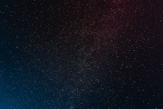 A vast expanse of the night sky filled with countless stars twinkling against a dark backdrop, creating a sense of depth and infinity.