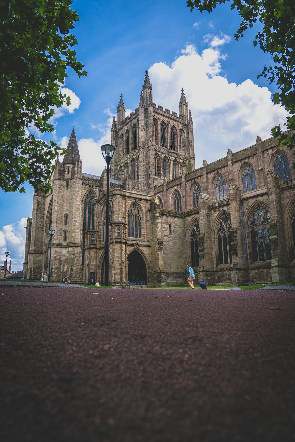 The stone exterior of Hereford Cathedral against a clear sky in the city of Hereford, Herefordshire
