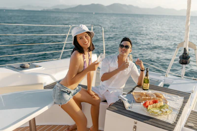 Group of friends enjoying a sunny day on a spacious privatized yacht deck.