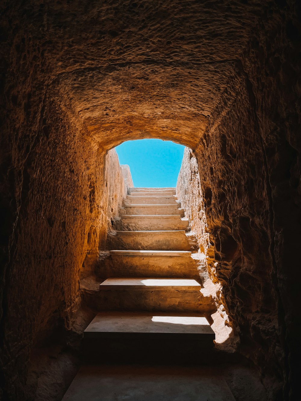 brown concrete tunnel during daytime