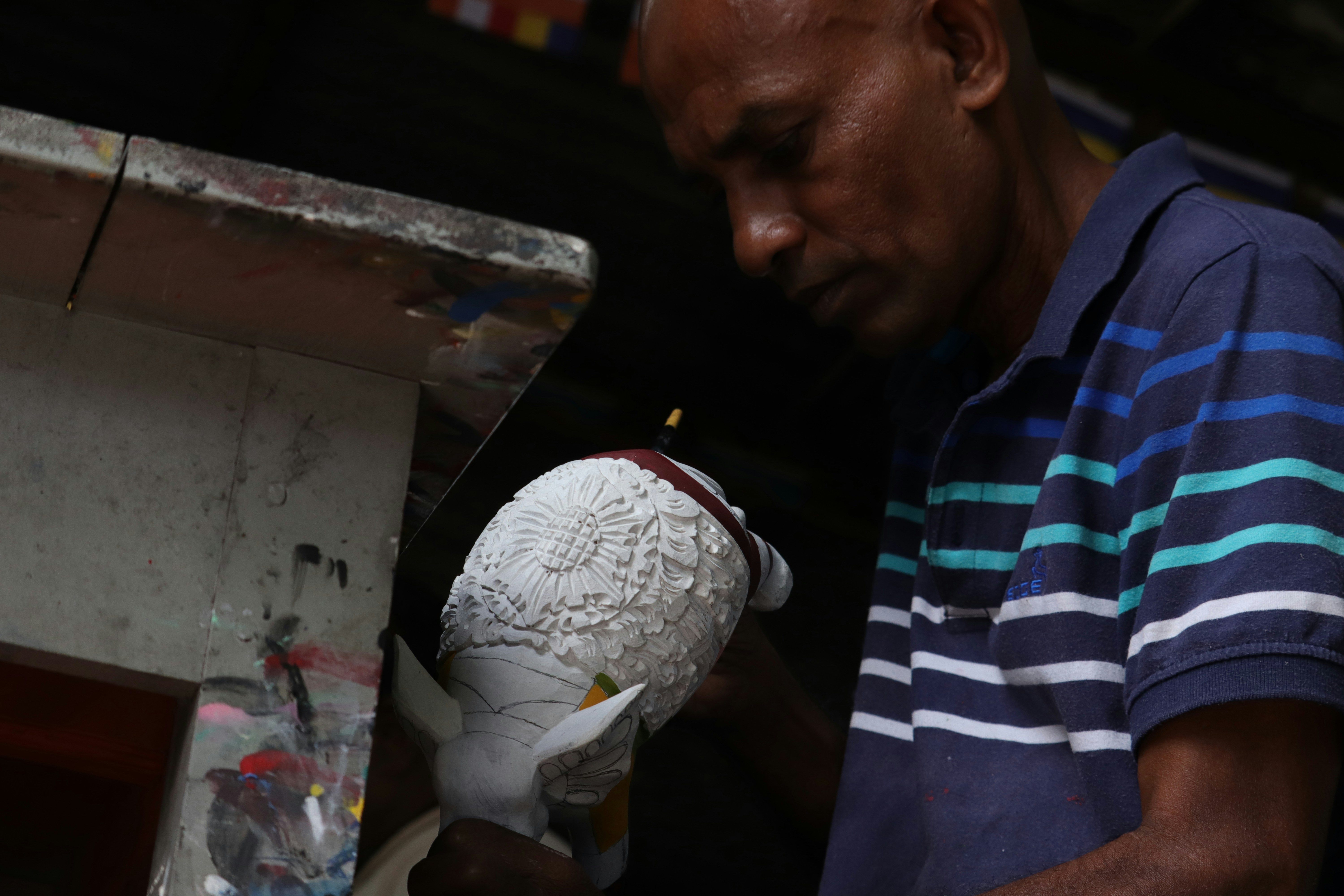 Foam sculptor working on a large custom piece
