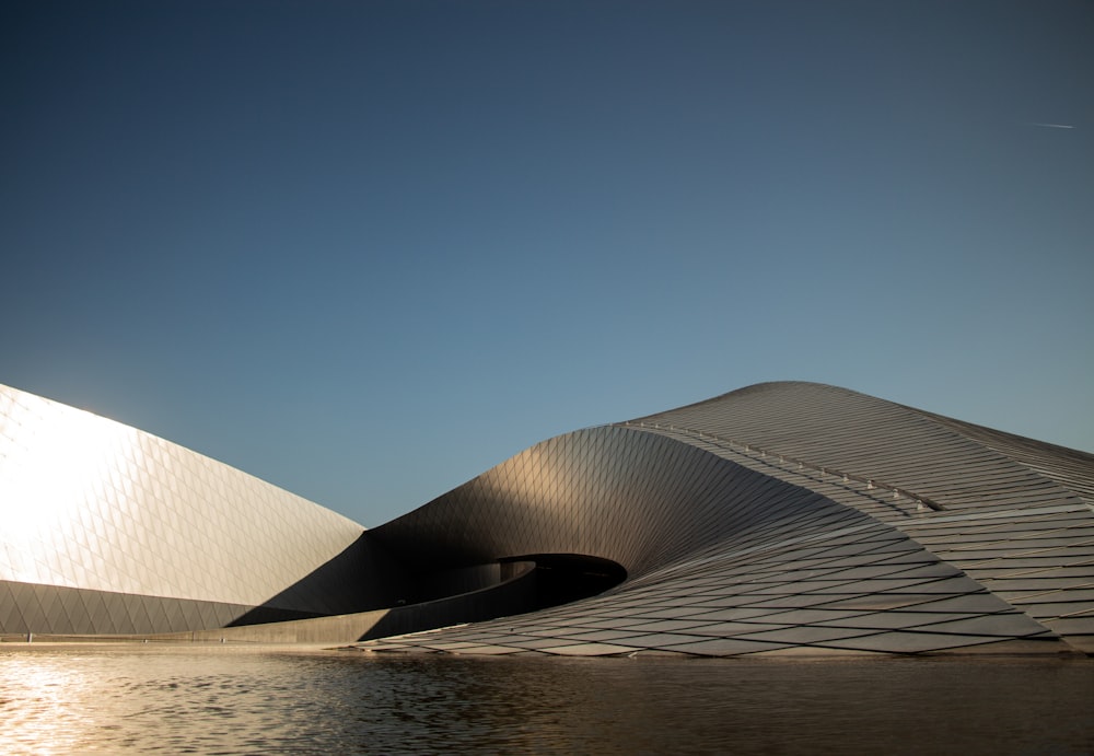 white concrete building near body of water during daytime