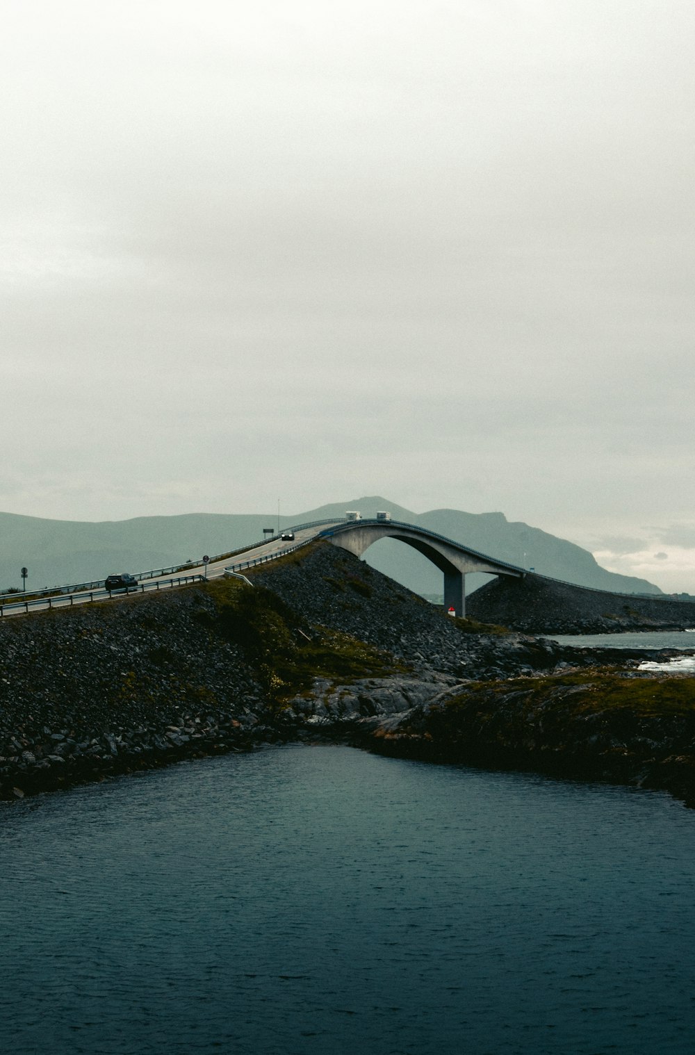 gray concrete bridge over the sea