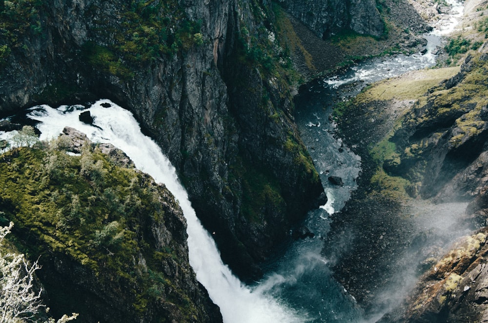 water falls on rocky mountain