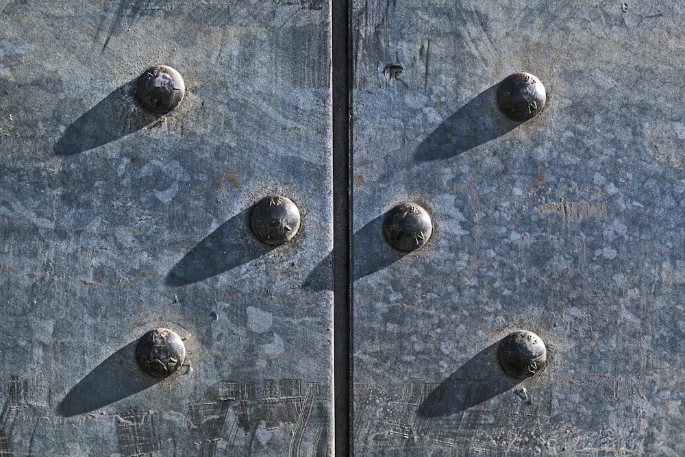 silver round coins on blue and white surface