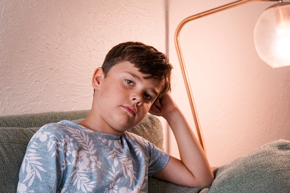 boy in blue and white crew neck t-shirt