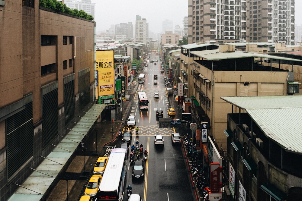 cars on road near buildings during daytime