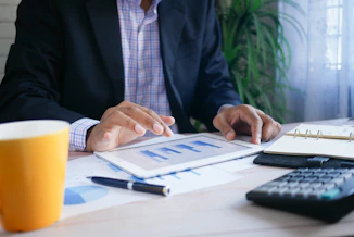 A business owner looking puzzled in front of a cluttered dashboard.