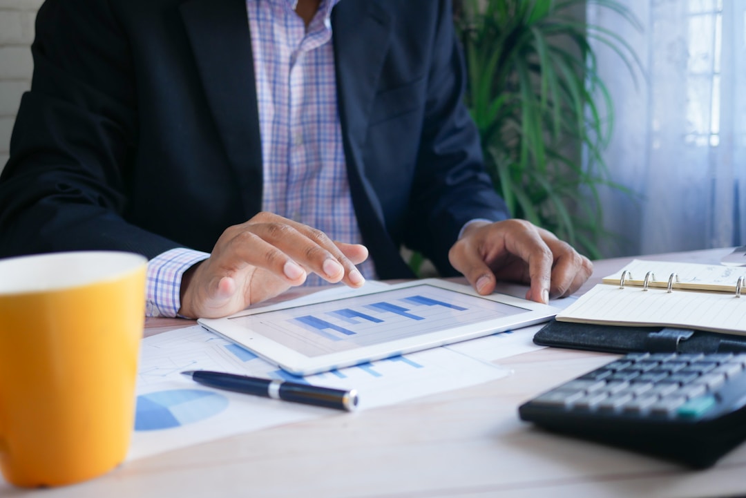 A business executive looks over bar chart data
