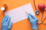 person writing on white paper