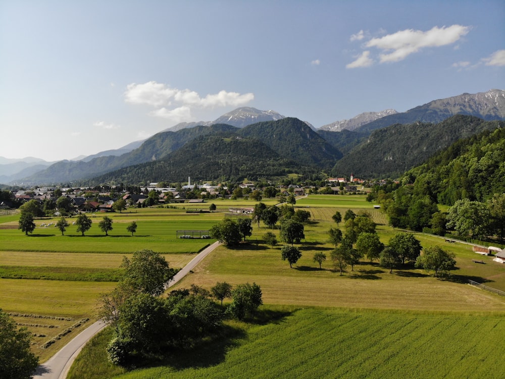 green grass field near mountain during daytime