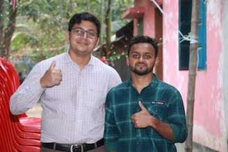 Team members smiling and giving thumbs up after completing a successful move.