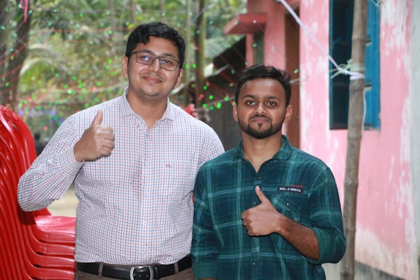 Smiling movers giving a thumbs-up after completing a smooth villa relocation.
