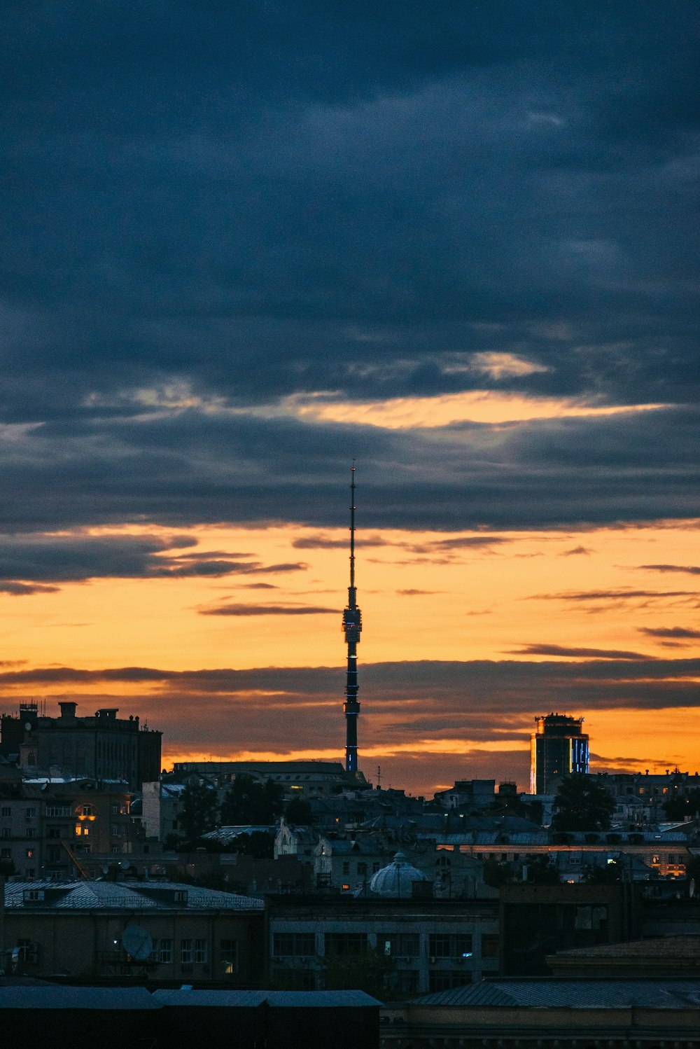 silhouette of city buildings during sunset