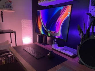 black and silver laptop computer on brown wooden table
