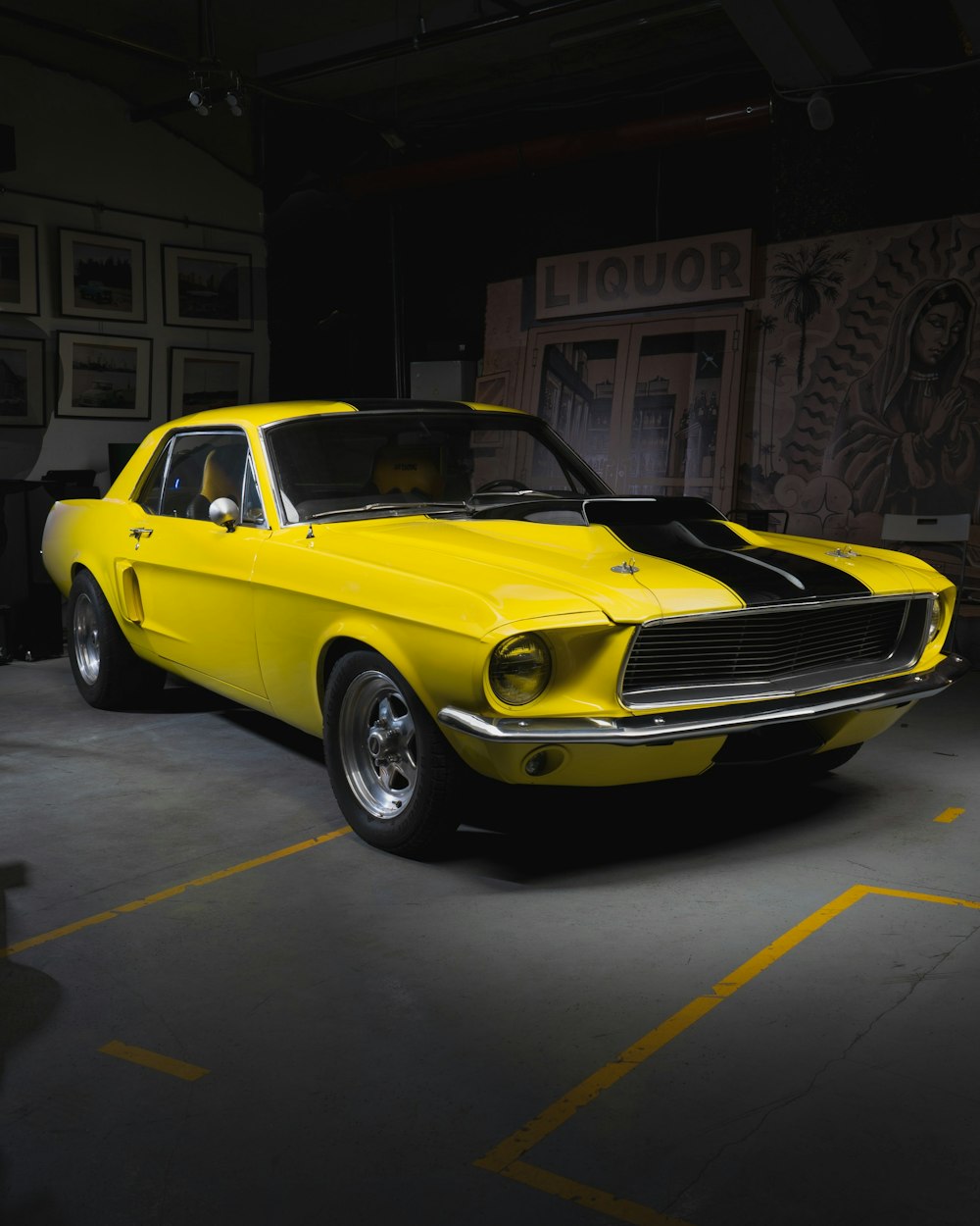 yellow chevrolet camaro parked in front of store