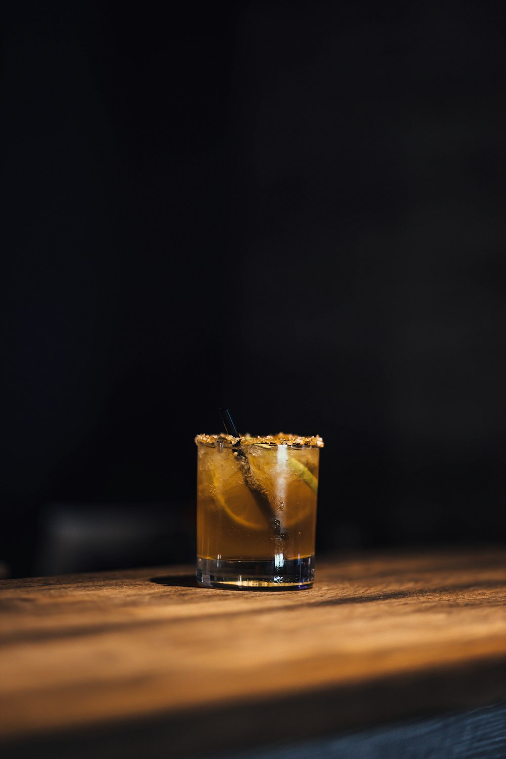 clear drinking glass with brown liquid