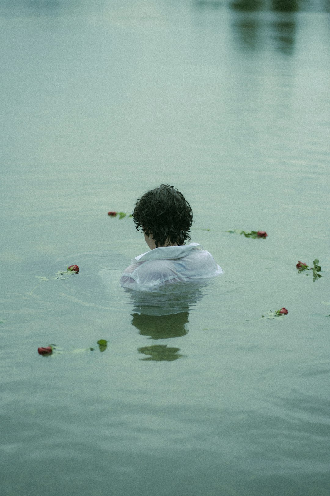 man in white shirt on water during daytime