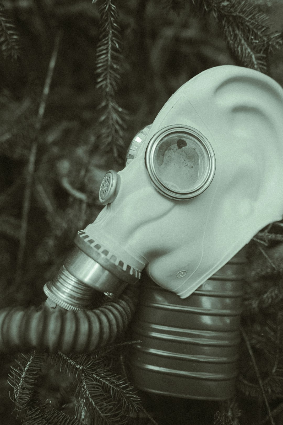 grayscale photo of person wearing gas mask