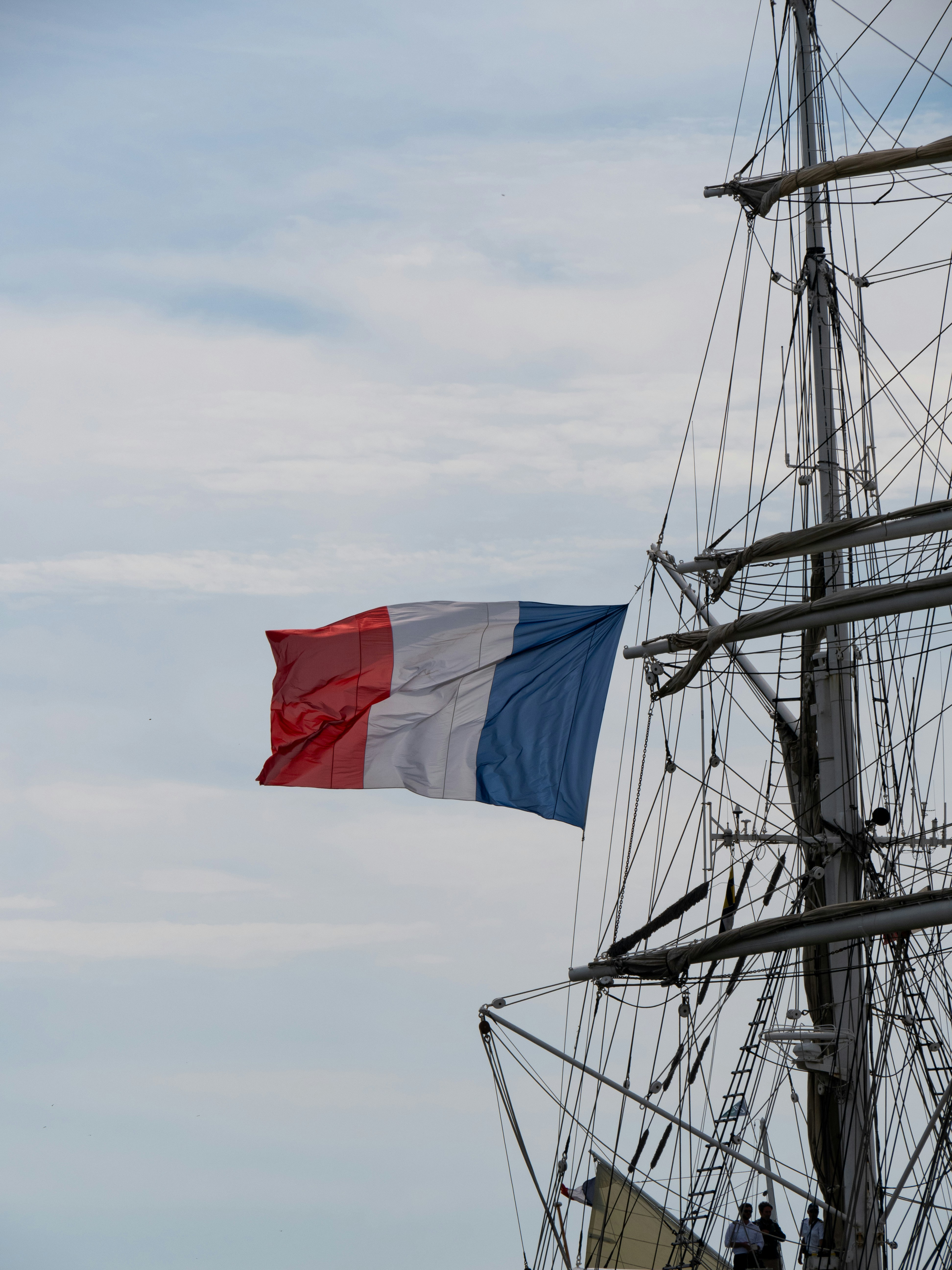 white red and blue flag on pole during daytime