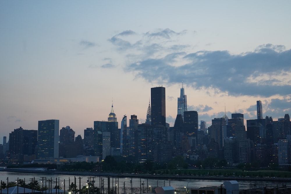 city skyline under white clouds during daytime