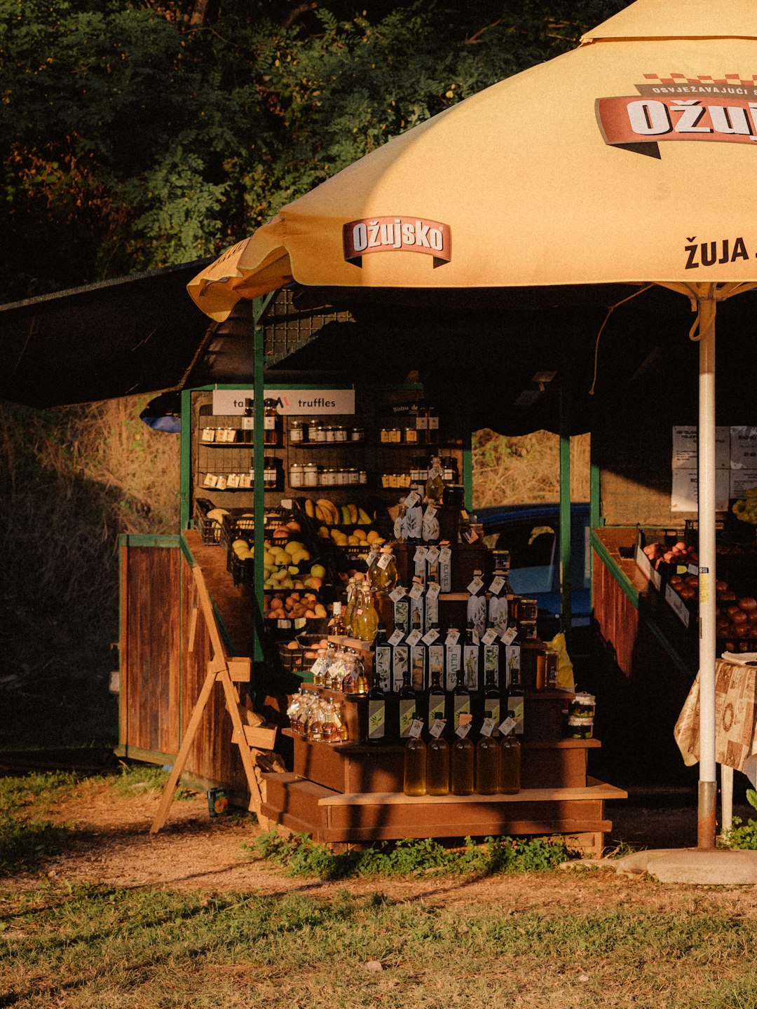 brown wooden store with white and brown patio umbrella