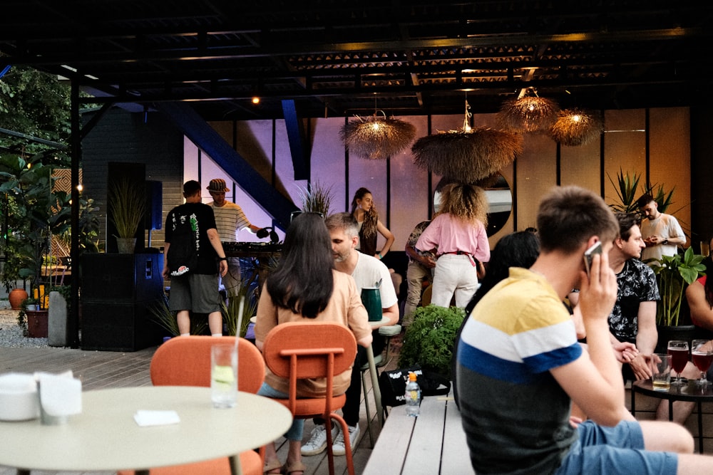 people sitting on chair in front of table