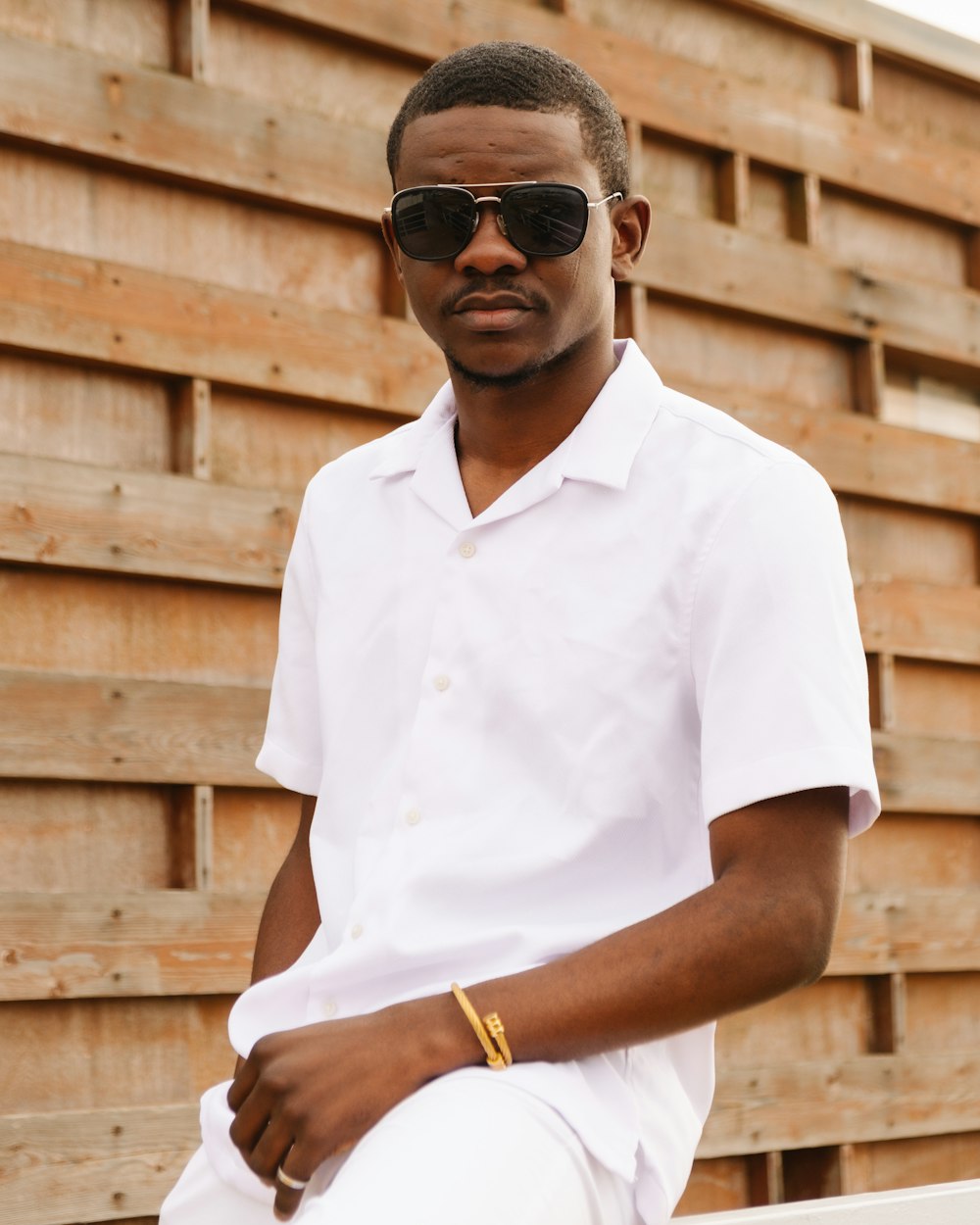 man in white button up shirt wearing black sunglasses