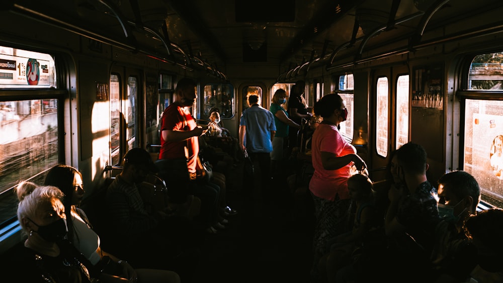 people in train during daytime
